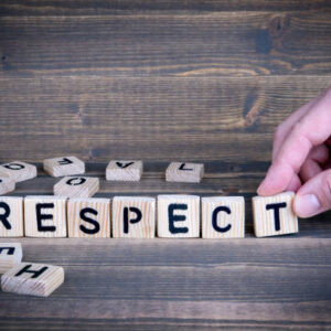 Respect. Wooden letters on the office desk, informative and communication background
